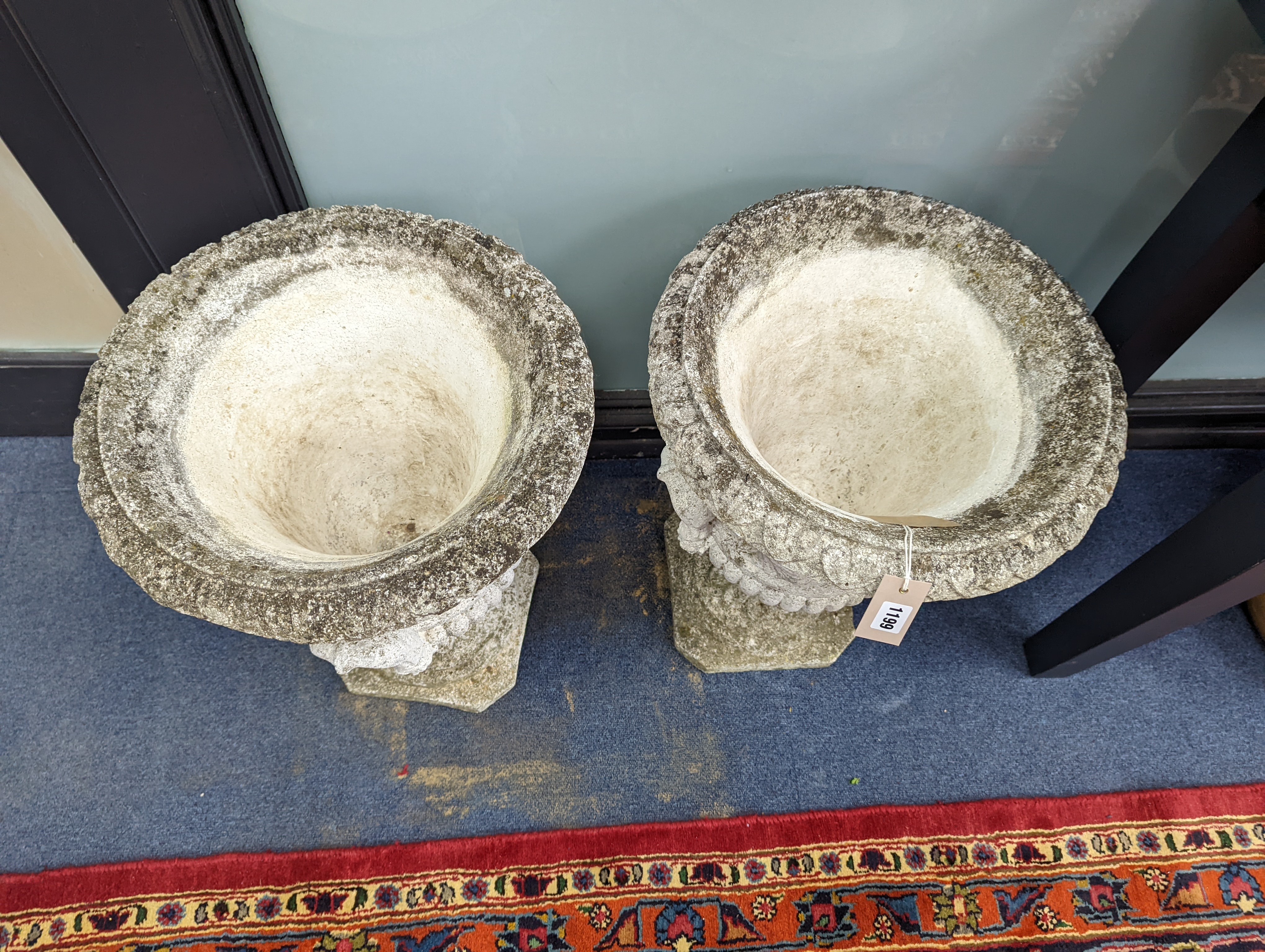 A pair of reconstituted stone campana garden urns, diameter 40cm, height 56cm